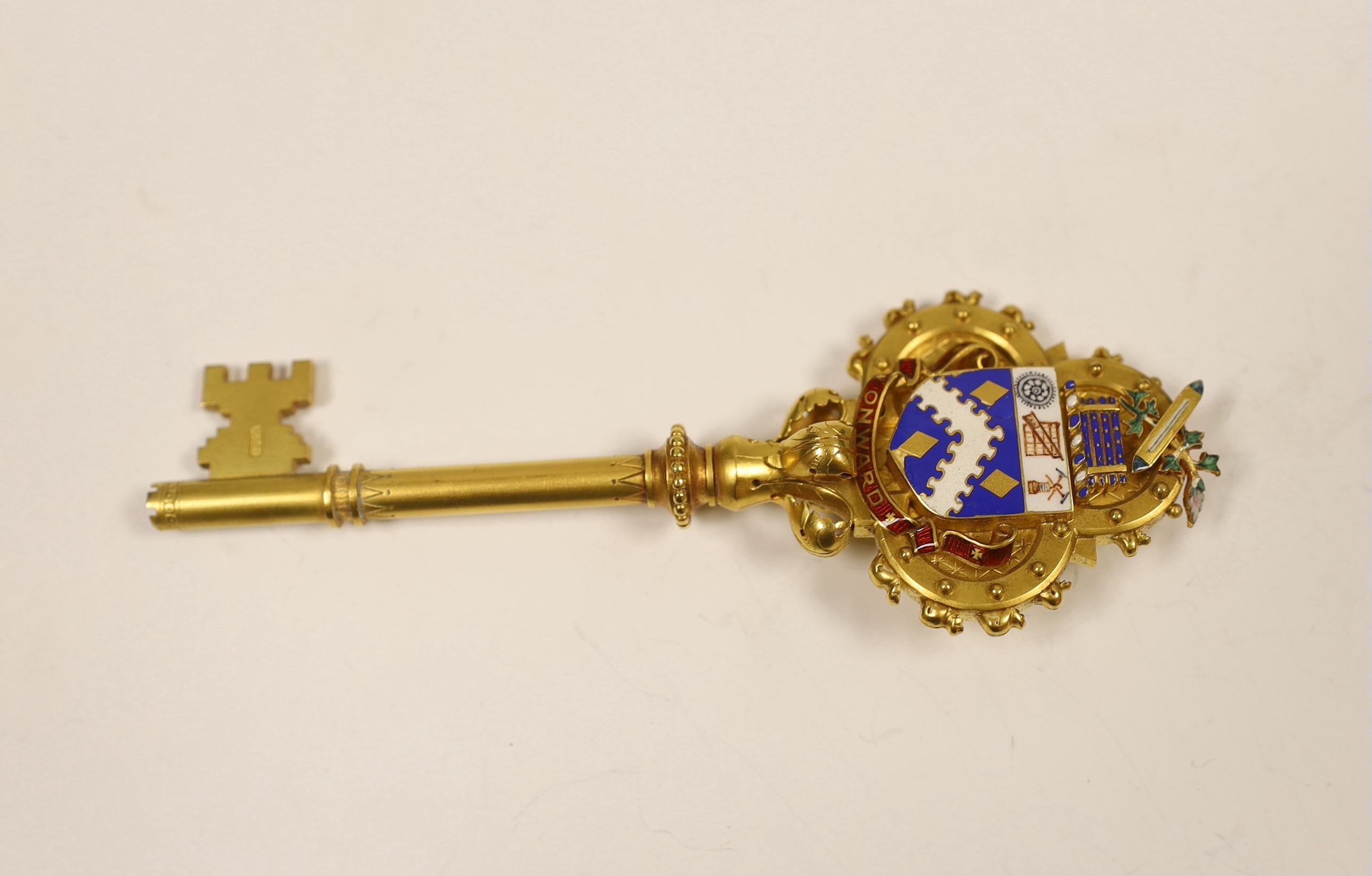 A cased Victorian gilt and polychrome enamelled presentation key, makers mark, M&M, 11.7cm, with engraved inscription relating to the presentation to Mayor Edward Hibbett, on the opening of the Town Hall in Hyde.